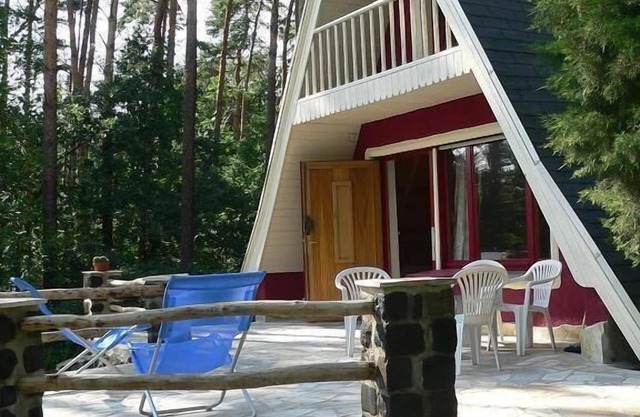 Holiday house in a quiet location by the edge of the forest, with a terrace and a large site