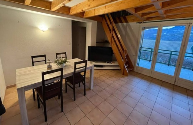 House between lake and mountain