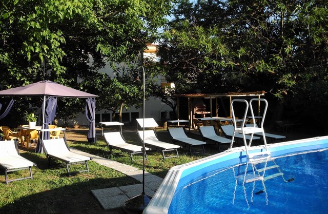 House with air conditioning,private garden and swimming pool in Massarosa