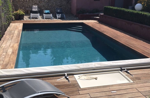 House with swimming pool and large garden in the heart of the village