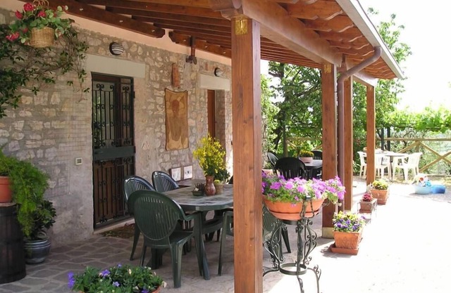 House with garden on green hills