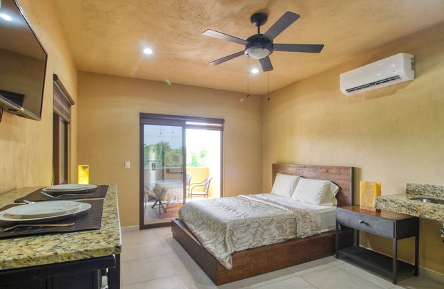 Ideal tropical escape with free WiFi, balcony, kitchenette & snack shack