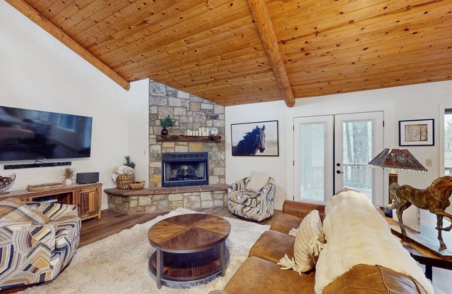 Immerse yourself in the charm of this delightful cabin tucked among the pines