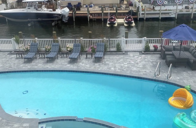 INGROUND POOL with CHILD SAFETY FENCE. Walking distance to BEACH. DOG friendly