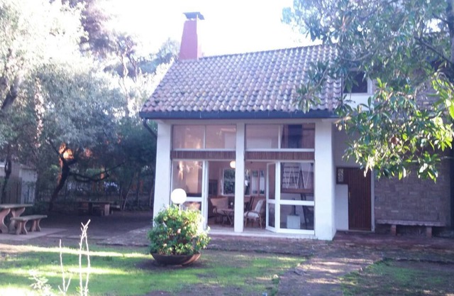 Villa with fenced garden among the pine trees near the sea, bright and comfortable