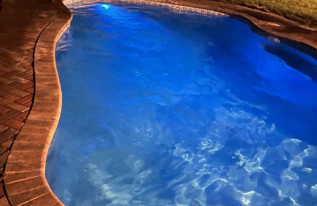 Lagoon shaped pool home with private back yard!