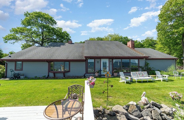 Lake Huron Beach Retreat has 3 bedrooms and 2 full baths with a sandy beach!