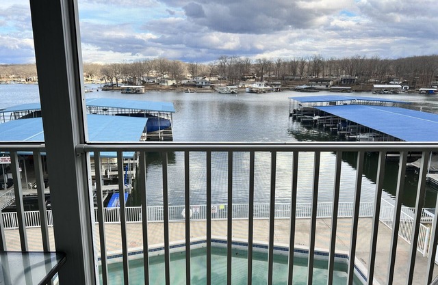 Lake Lodge Condo overlooking The swimming pool and the￼ Lake of the Ozarks