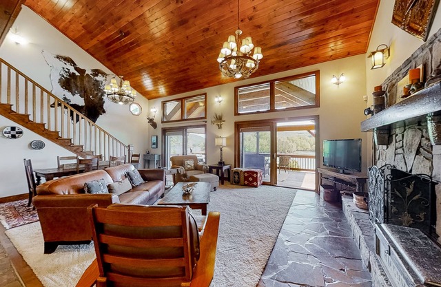 Lakefront home with amazing views, grill, fire pit, private dock, & AC