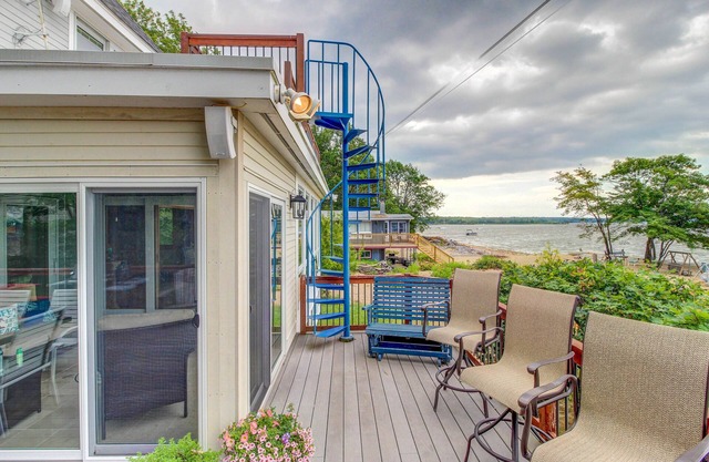Lakefront home with water access, views of the mountains, private deck & patio