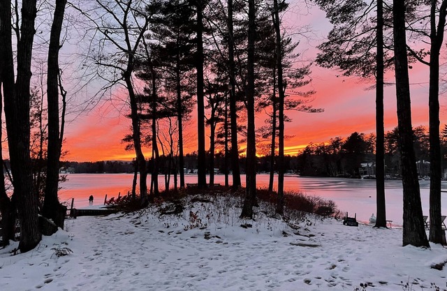 Lakefront & ski retreat with wrap-around deck, wood fireplace, & private beach