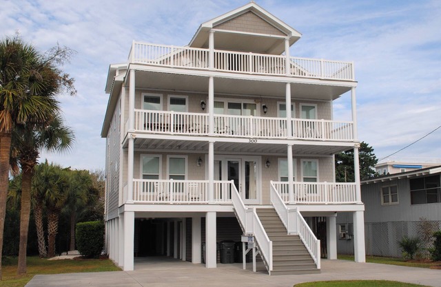 Large home with private swimming pool located second row at South Litchfield in Pawleys Island.