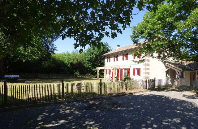 Large house between lake and forest