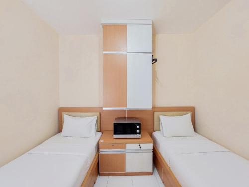 Minimalist Studio Room Apartment at Aeropolis Residence By Travelio
