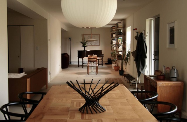 Modern house in the woods with a pond