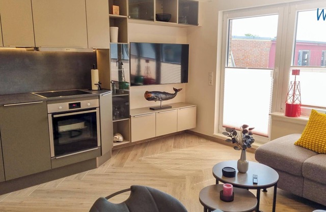 Modern vacation apartment with balcony and comfortable furnishings on Borkum