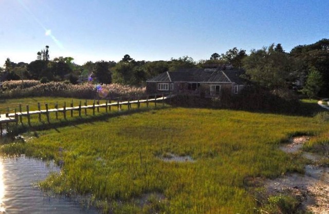 NESTLED ALONG BANKS OF ASSATEAGUE BAY OVERLOOKING THE SALT MARSHES!