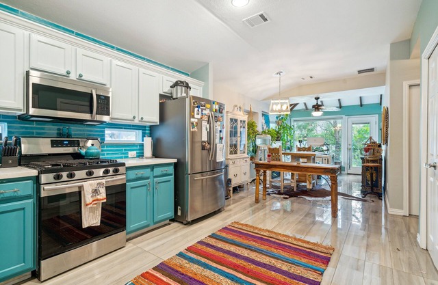 NEW LISTING! Eclectic Oasis: Artful & Colorful Comfort by RedAwning