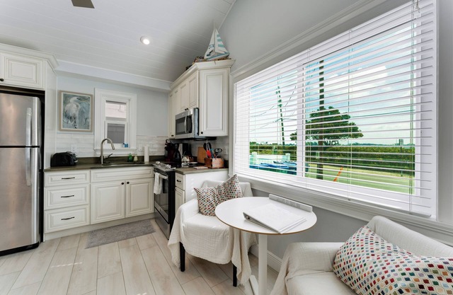 NEW LISTING.nHigh Tide—- Beach and Bay just steps away!n