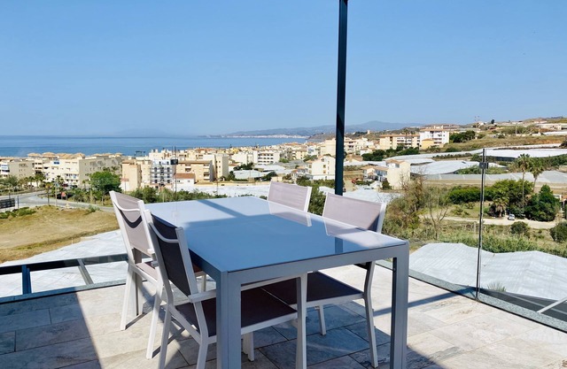 Newly built, at the top with large terraces and sea views