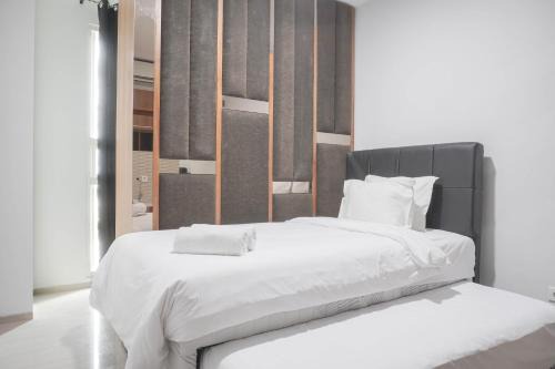 Nice and Comfort 1BR at Citralake Suites Apartment By Travelio