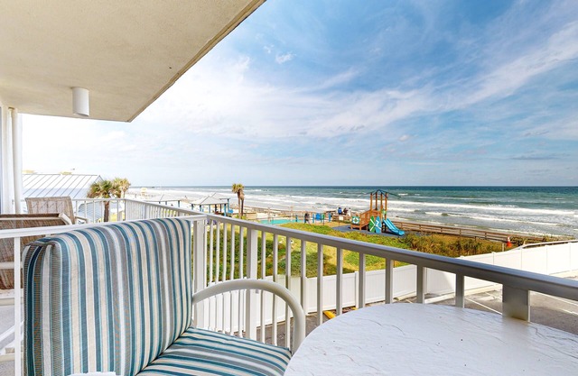 Oceanfront condo with pool, hot tub, balcony, game room, and fitness room