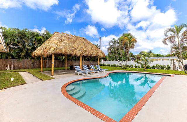 Pool Home W Beautiful Tiki Hut - 3 Bed 3 Bath. 1 mile from beach!