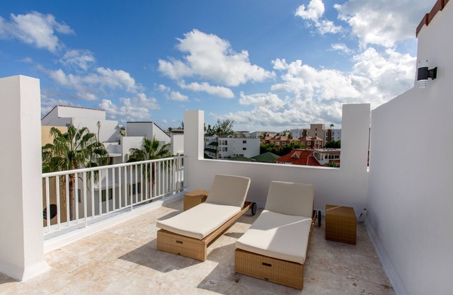 Pristine Beach with Crystal-clear water for your getaway. 4BR, Pool, Rooftop.