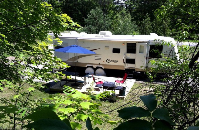 Private Caravan on beautiful 2.5 acre wooded setting close to village and beach