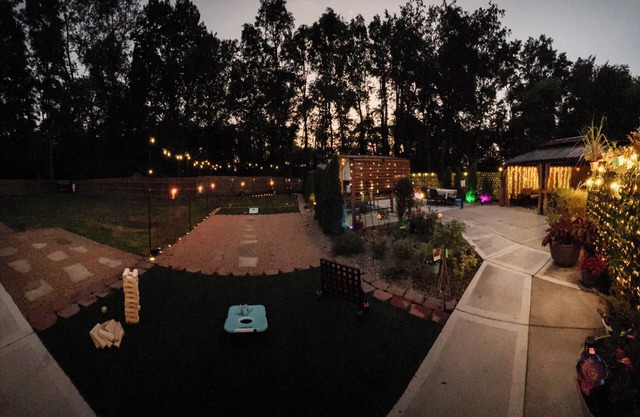 Private Urban Oasis with heated pool spa, outdoor bar and TV, firepit, corn hole