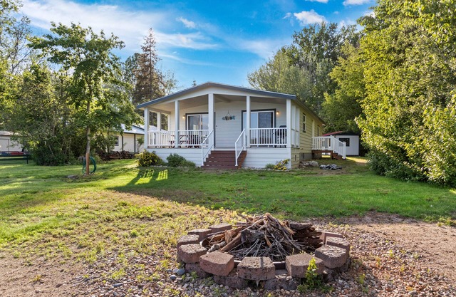Private waterfront home with a firepit, deck, W/D, and WiFi - pretty lake views