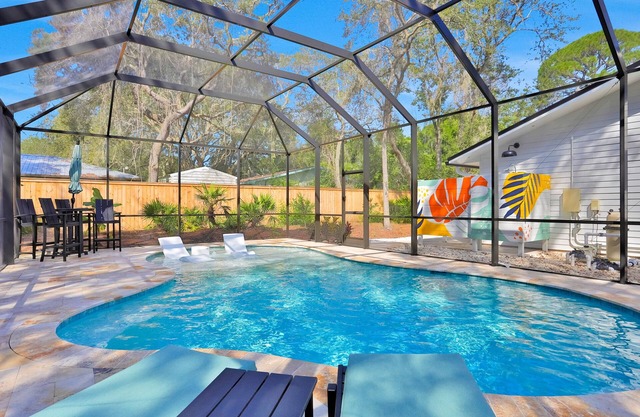 Renovated home with private pool, patio, outdoor fireplace, & grill