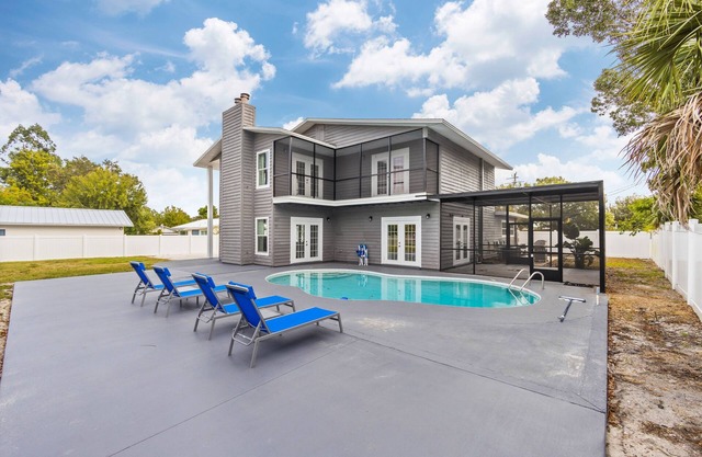 Renovated home with enclosed yard, private pool, screened patio, & W/D
