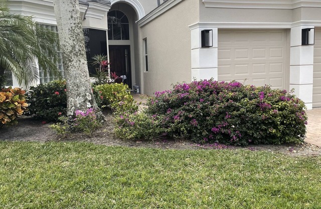 Renovated open floor plan with large heated pool and screened lanai with dining.