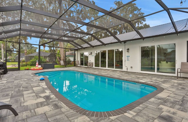 Riverside luxury home with covered pool - Your ultimate retreat for relaxation