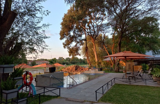 Riverside Splash- Stylish and Cozy Cottages by the River bank