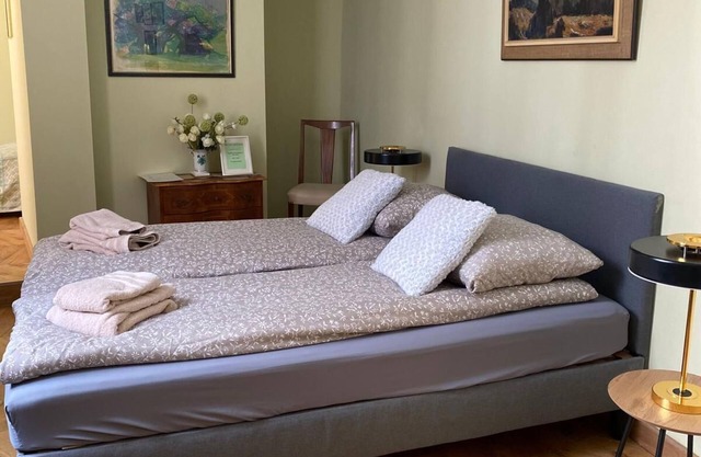 Room with bathroom in the center of the city in a 600-year-old house