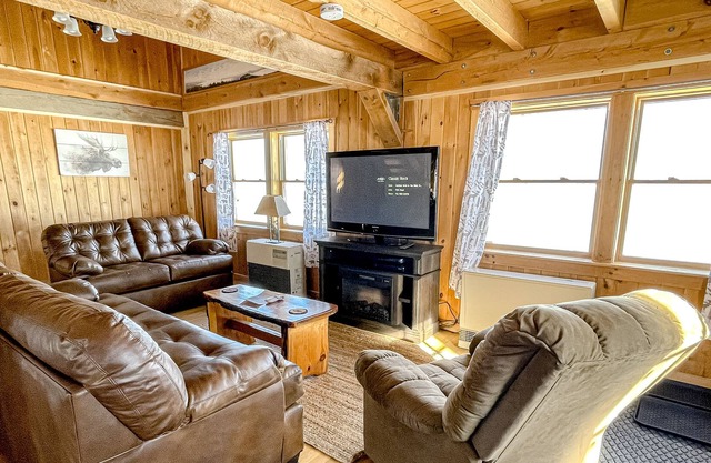 Rustic dog-friendly lakefront home with private beach, lake views, firepit, AC