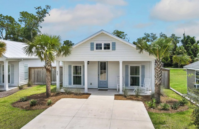 Salty Blue is a new 2BD/2BA cottage, walking distance to restaurants & shops! Pool and fenced yard!
