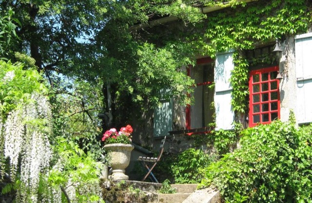 Simple stone farmhouse and garden in 12th century village