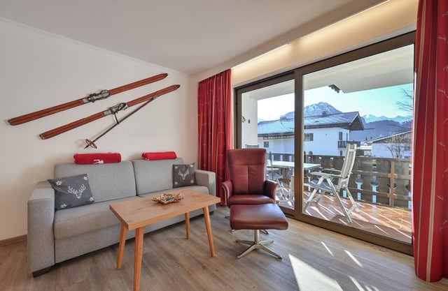 Small but nice with balcony, underground parking space, free summer cable car ticket