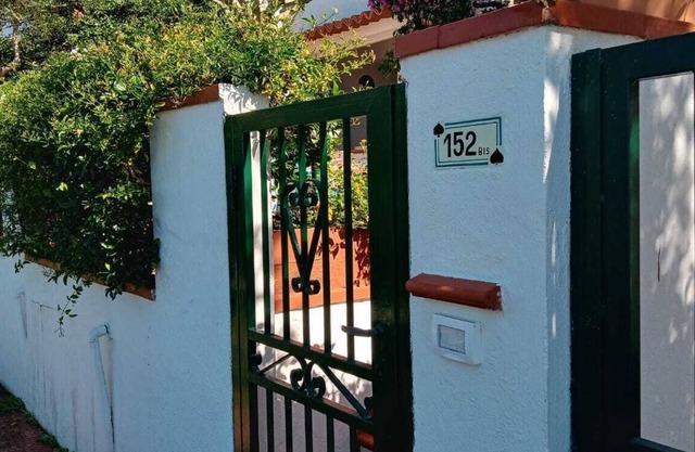 Small house with large terrace overlooking the sea