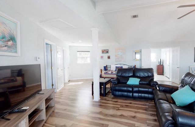 Spacious bay front getaway with dock, canal access, gas grill, & furnished deck