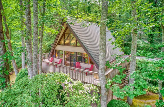 Spacious, dog-friendly A-frame cabin with a furnished deck, gas fireplace, & AC