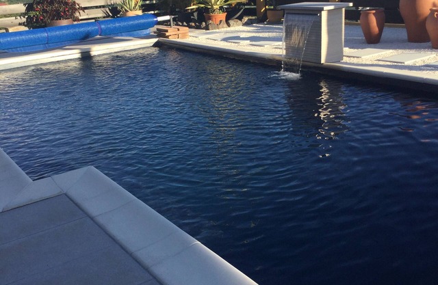 Spacious furnished ground-floor villa with shared pool and superb views.