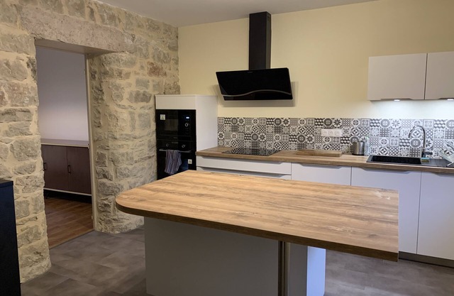 Spacious house with garden, bordered by the village stream