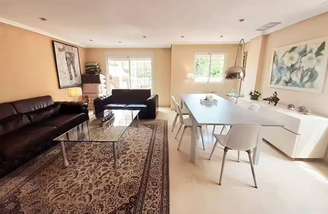 Spacious townhouse in Alicante close to sea and golf with shared sparkling pool.
