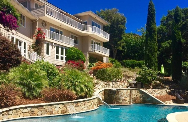 Spectacular home, custom beach-entry pool, putting green, sports court and more