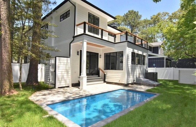 Stunning contemporary home with a private pool and walking distance to the beach