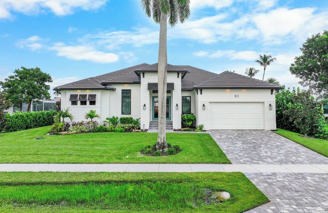 Stunning waterfront home w/heated pool & hot tub
